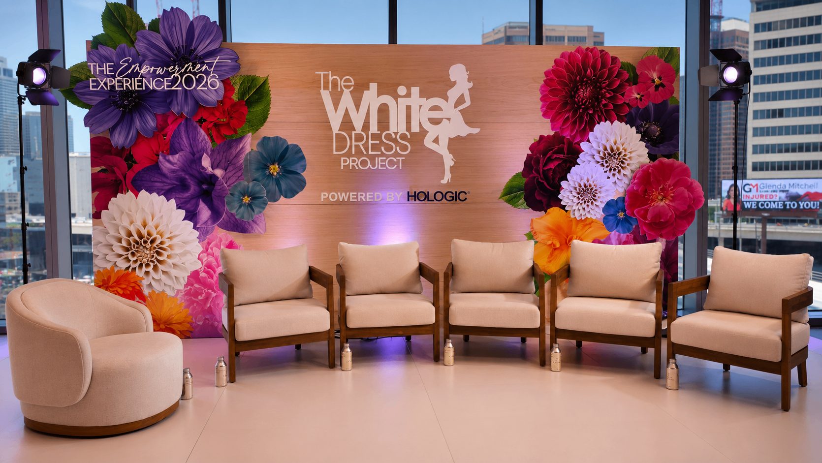 The White Dress Project Empowerment Experience 2026 stage with floral backdrop by ON-POINTAV in Atlanta