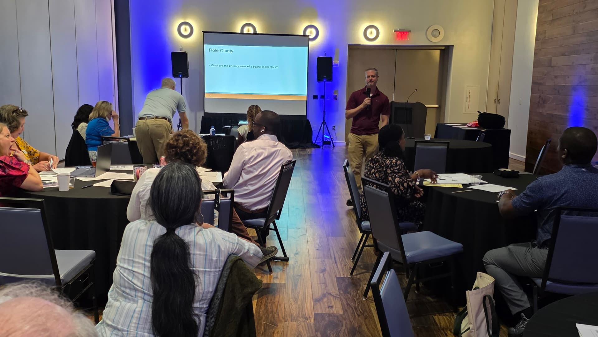 Board of Directors retreat produced by ON-POINTAV in Atlanta — presentation stage, LED screen, and live audio