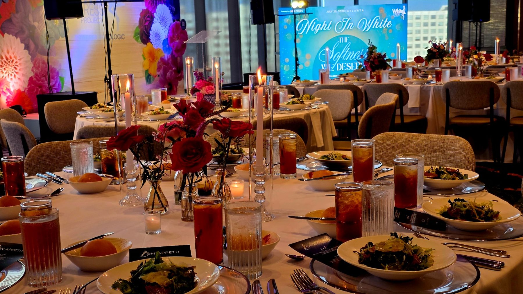 Night In White candlelit dinner setting with LED signage produced by ON-POINTAV