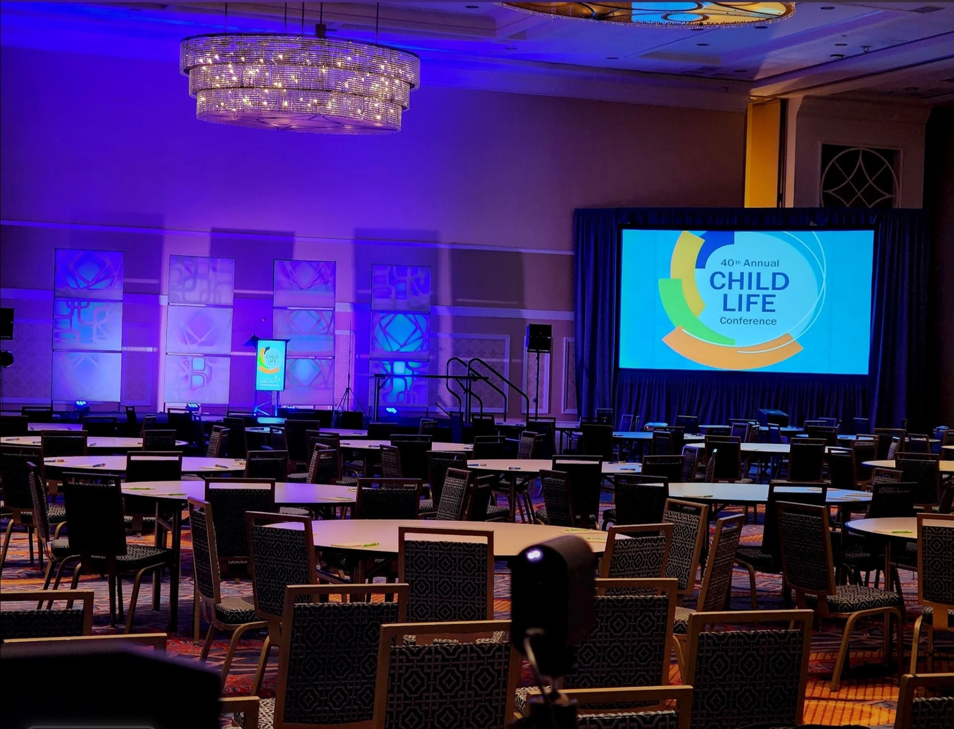 40th Annual Child Life Conference ballroom setup with projection