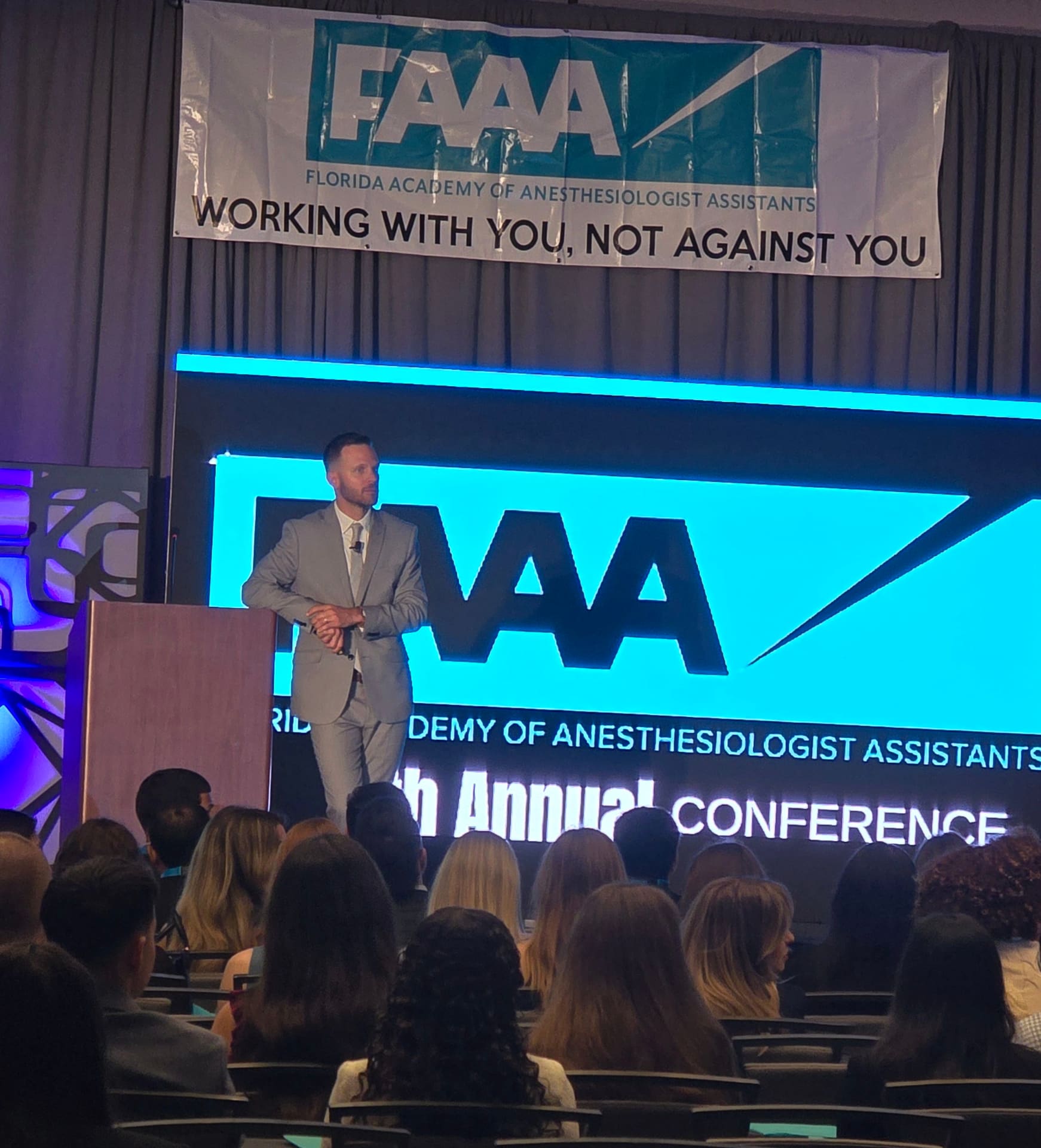 ON-POINTAV LED wall display at Atlanta conference with speaker presenting