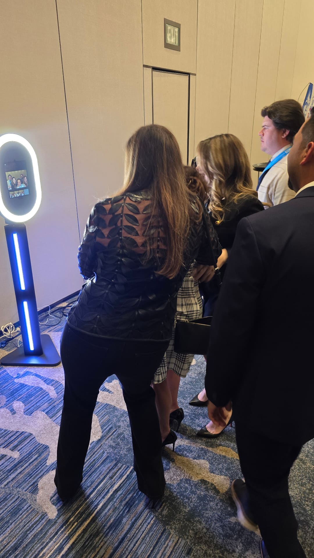 Guests using ON-POINTAV selfie booth at Atlanta corporate conference